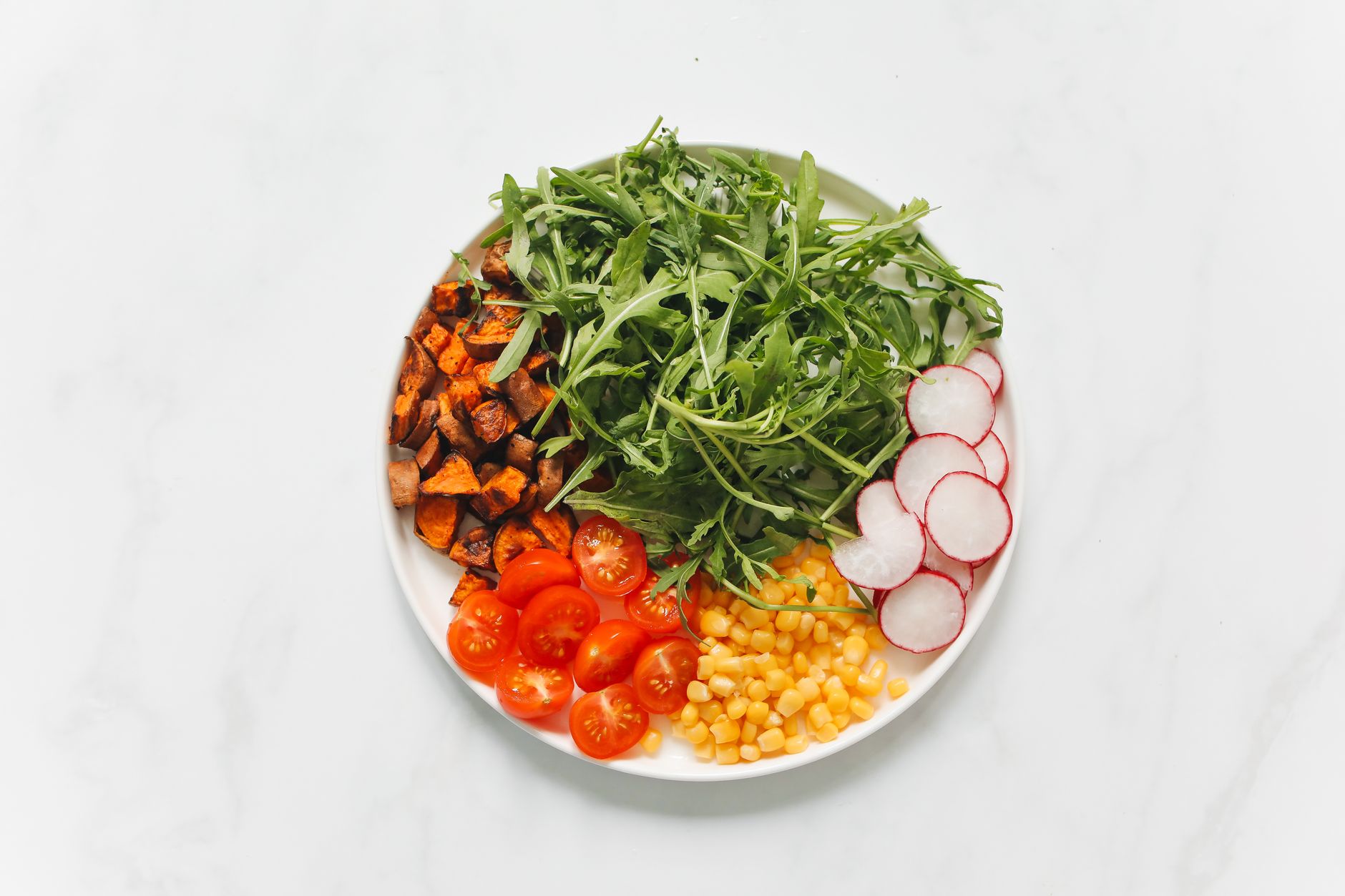 Roasted Sweet Potato Rainbow Salad with Lime Crema
