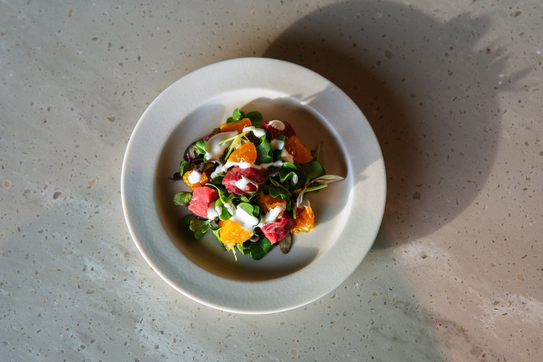 Goat's curd & spring greens salad with popped buckwheat