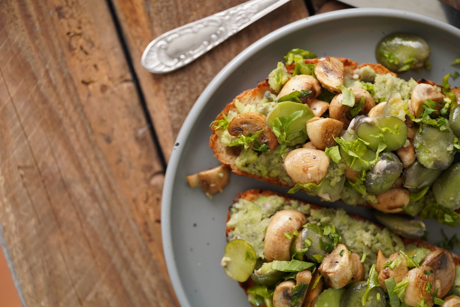 Summer beans on toast with prosciutto