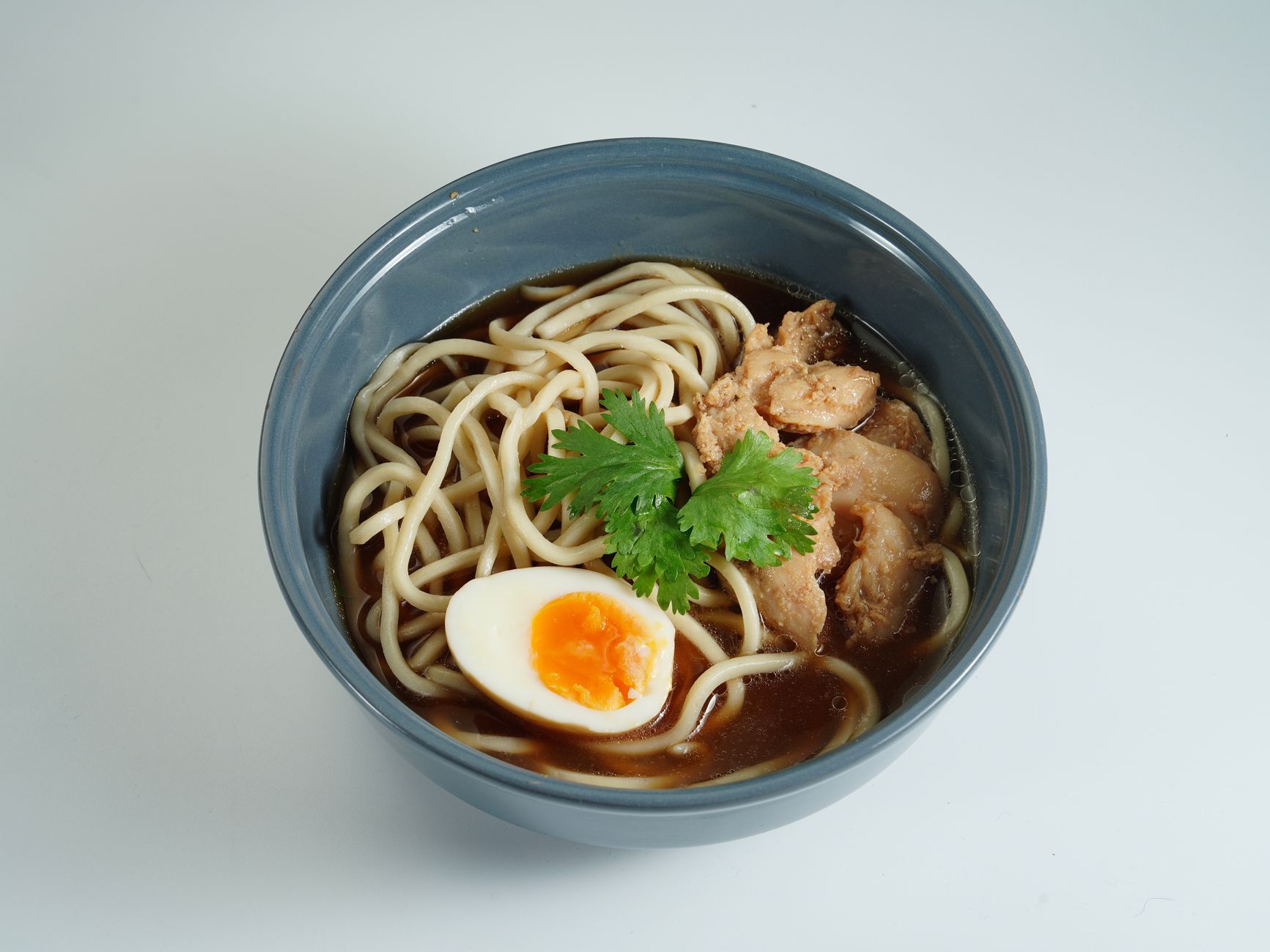 Golden noodle soup with soft-boiled eggs