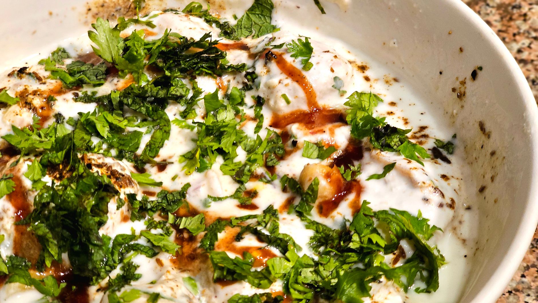 Lentil dumplings in yogurt (dahi bhalla)